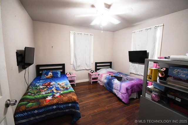 474679 E 1050th Rd, Muldrow, OK 74948 - bedroom with wood finished floors, a ceiling fan, and baseboards