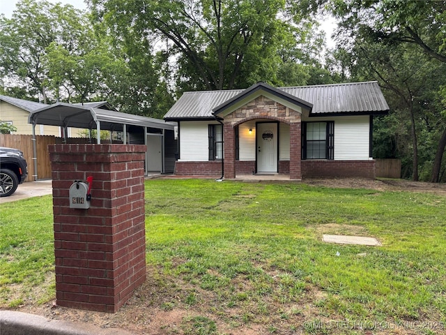 914 3rd Ave NE, Ardmore, OK 73401 - view of front of house with metal roof and stone siding