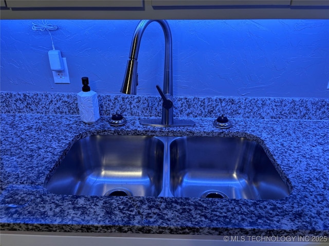 914 3rd Ave NE, Ardmore, OK 73401 - kitchen view of a sink and dark stone countertops