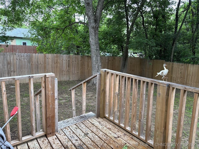 914 3rd Ave NE, Ardmore, OK 73401 - wooden terrace featuring a fenced backyard