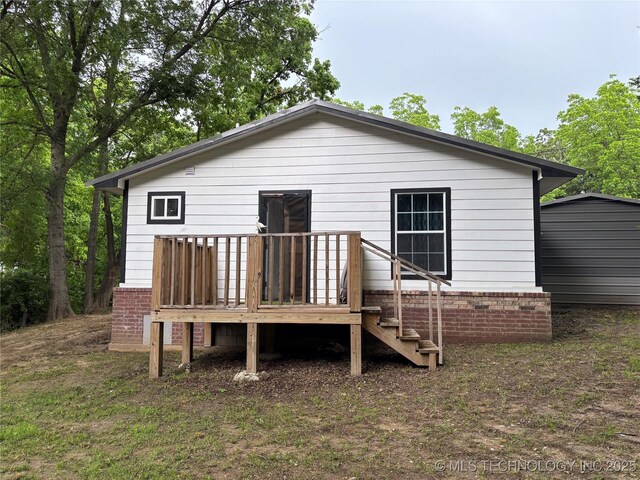914 3rd Ave NE, Ardmore, OK 73401 - back of house with a wooden deck