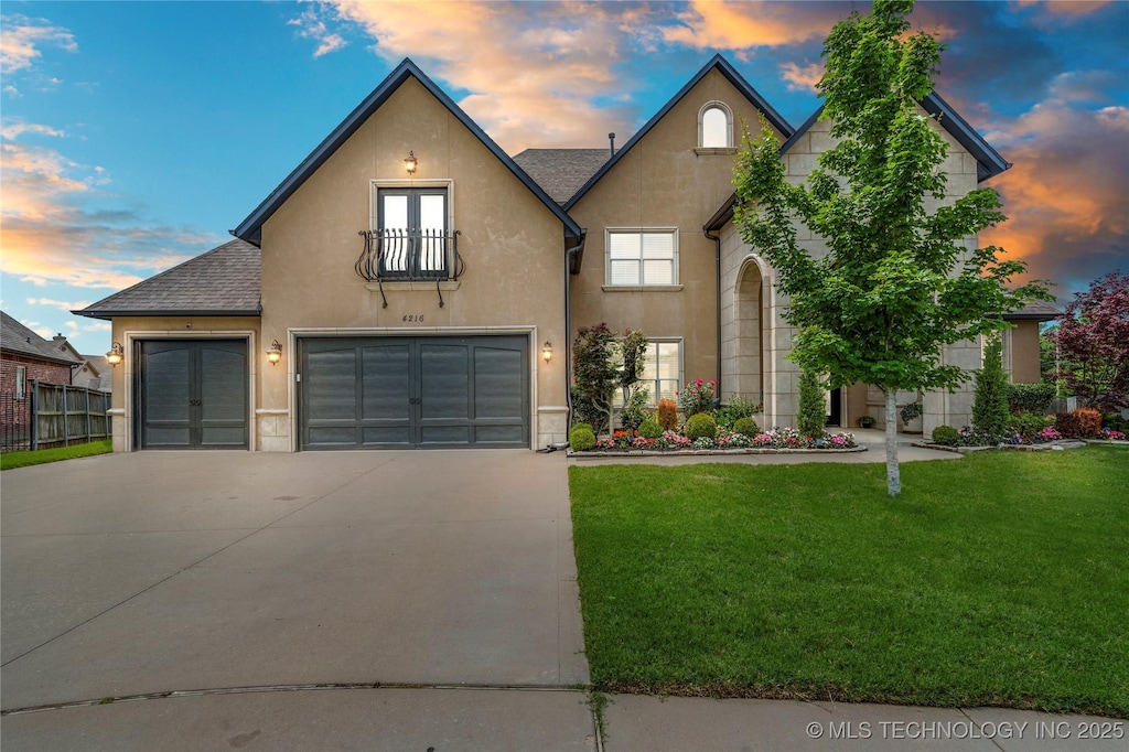 4216 W Orlando St, Broken Arrow, OK 74011 - view of front of house with driveway, stucco siding, french doors, a shingled roof, and an attached garage