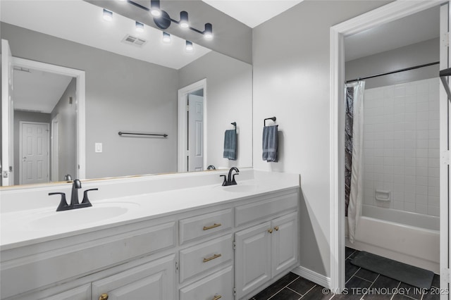 11937 S 18th St, Jenks, OK 74037 - full bathroom with double vanity, tile patterned flooring, shower / tub combo, and baseboards