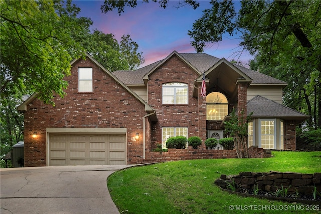 11937 S 18th St, Jenks, OK 74037 - traditional-style house featuring concrete driveway, brick siding, a yard, a garage, and roof with shingles