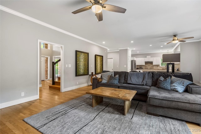 11937 S 18th St, Jenks, OK 74037 - living room featuring a ceiling fan, light wood-style floors, recessed lighting, crown molding, and baseboards