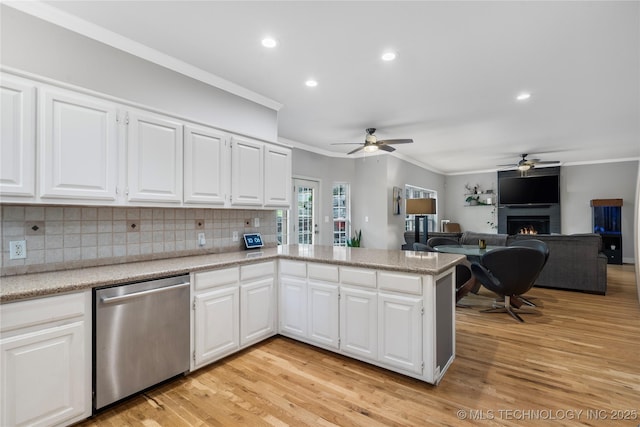 11937 S 18th St, Jenks, OK 74037 - kitchen featuring stainless steel dishwasher, ceiling fan, ornamental molding, a warm lit fireplace, and backsplash