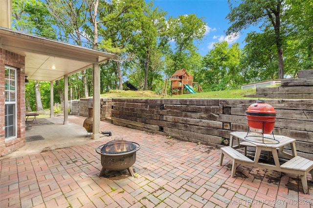 11937 S 18th St, Jenks, OK 74037 - view of patio / terrace featuring an outdoor fire pit and a playground
