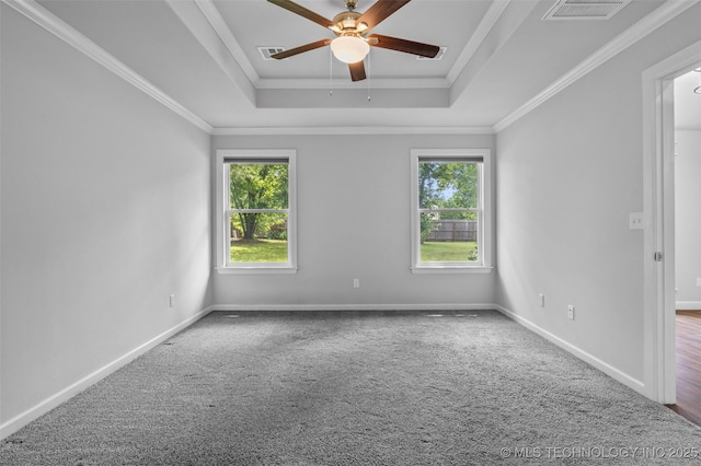 21893 S Arlene Dr, Claremore, OK 74019 - spare room with a raised ceiling, healthy amount of natural light, a ceiling fan, carpet, and crown molding