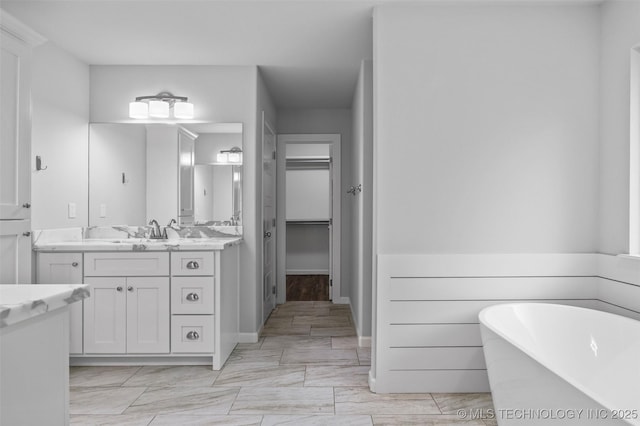 21893 S Arlene Dr, Claremore, OK 74019 - bathroom with a soaking tub, vanity, and a walk in closet