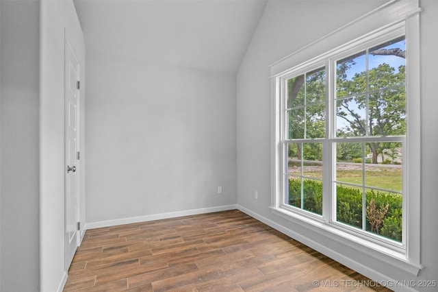 21893 S Arlene Dr, Claremore, OK 74019 - spare room with vaulted ceiling, wood finished floors, and baseboards