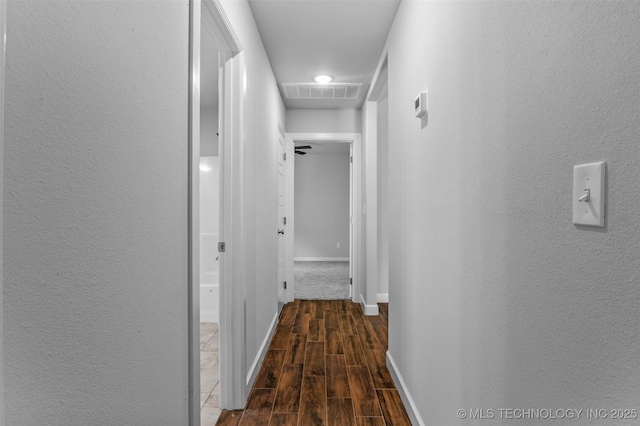 21893 S Arlene Dr, Claremore, OK 74019 - hallway with wood finished floors, a textured wall, and baseboards