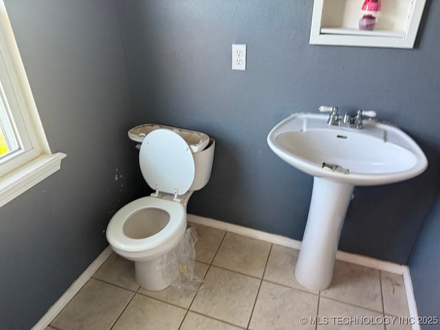903 S Lynn Ln, Tulsa, OK 74108 - bathroom with toilet, tile patterned flooring, and baseboards
