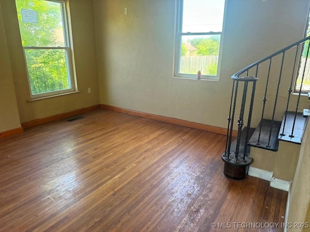 903 S Lynn Ln, Tulsa, OK 74108 - empty room with wood-type flooring and baseboards