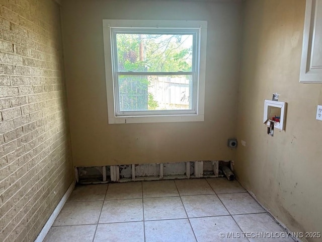 903 S Lynn Ln, Tulsa, OK 74108 - laundry area featuring washer hookup, hookup for an electric dryer, and light tile patterned floors