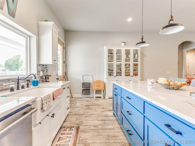 23814 E 91st St S, Broken Arrow, OK 74014 - kitchen with blue cabinetry, white cabinetry, arched walkways, and recessed lighting