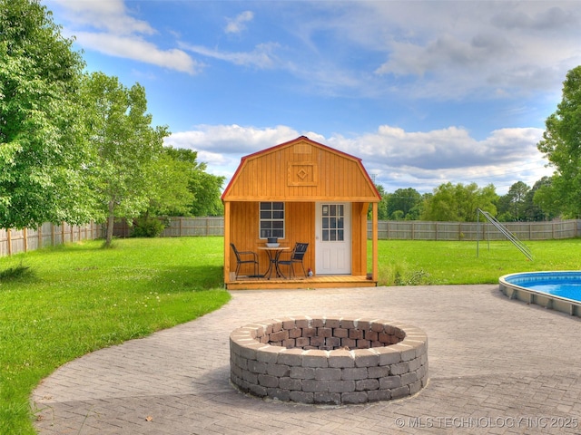 23814 E 91st St S, Broken Arrow, OK 74014 - view of patio with an outdoor fire pit and an outdoor structure
