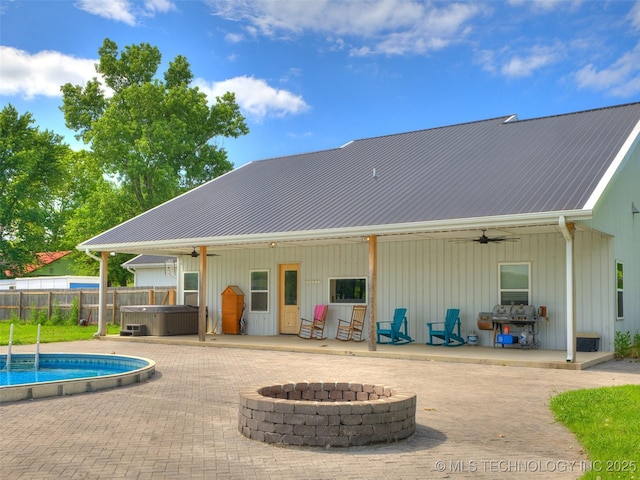 23814 E 91st St S, Broken Arrow, OK 74014 - back of property featuring a ceiling fan, a fire pit, and a patio area