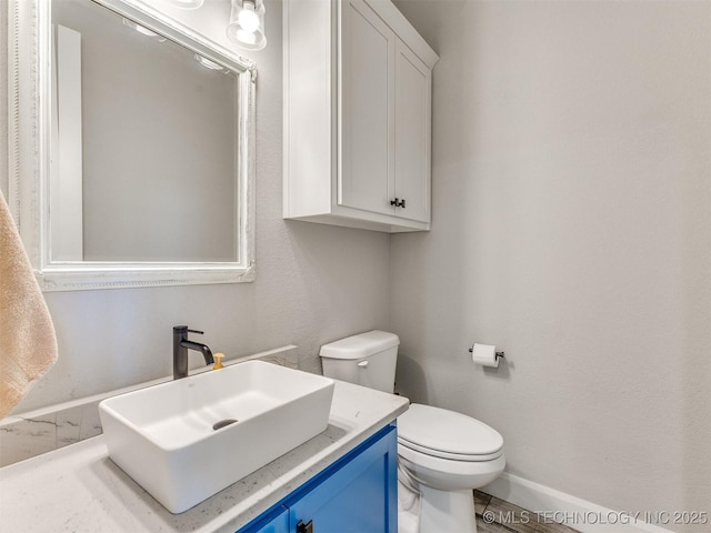 23814 E 91st St S, Broken Arrow, OK 74014 - bathroom featuring baseboards, toilet, and vanity