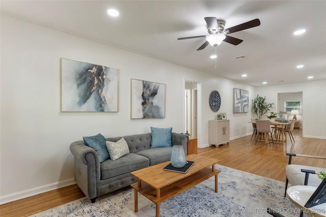 4514 S Quaker Ave, Tulsa, OK 74105 - living room featuring baseboards, recessed lighting, ceiling fan, and light wood-style floors