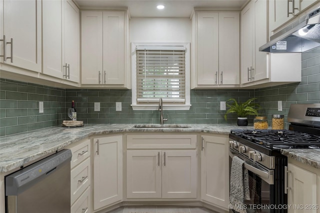 4514 S Quaker Ave, Tulsa, OK 74105 - kitchen featuring stainless steel appliances, under cabinet range hood, a sink, white cabinets, and recessed lighting