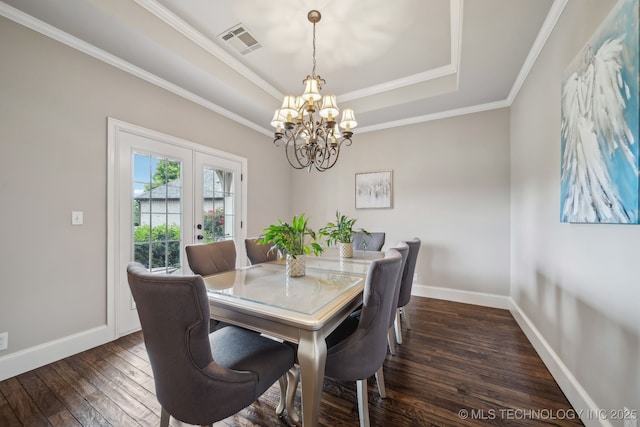 7734 S Indian Ave, Tulsa, OK 74132 - dining space with a raised ceiling, french doors, dark wood finished floors, a chandelier, and baseboards