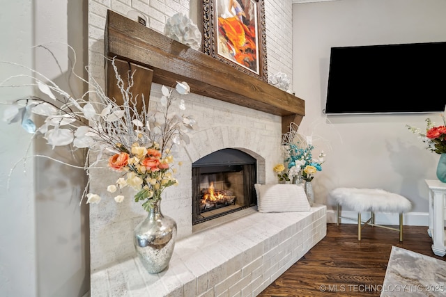 7734 S Indian Ave, Tulsa, OK 74132 - living room with a fireplace, wood finished floors, and baseboards