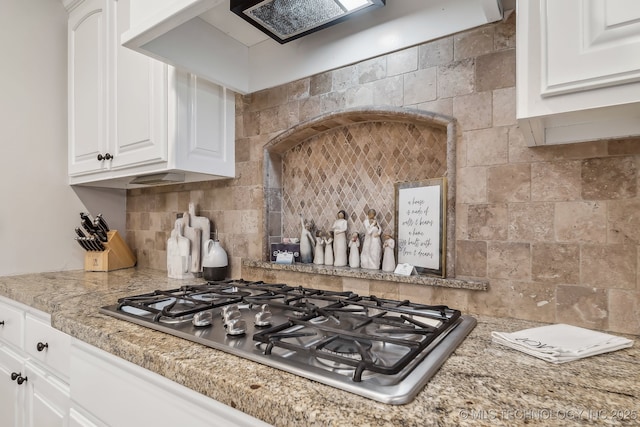 7734 S Indian Ave, Tulsa, OK 74132 - kitchen featuring stainless steel gas cooktop, decorative backsplash, and white cabinets