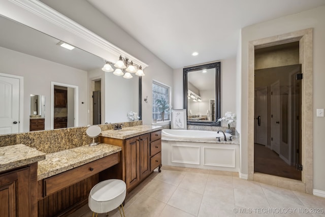 7734 S Indian Ave, Tulsa, OK 74132 - bathroom featuring a garden tub, a shower stall, vanity, and tile patterned floors