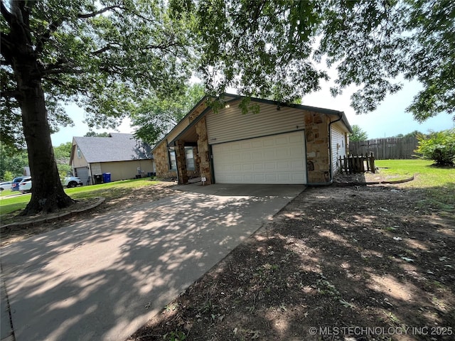 1700 S Cypress Ave, Broken Arrow, OK 74012 - view of front of home featuring stone siding, driveway, and a garage