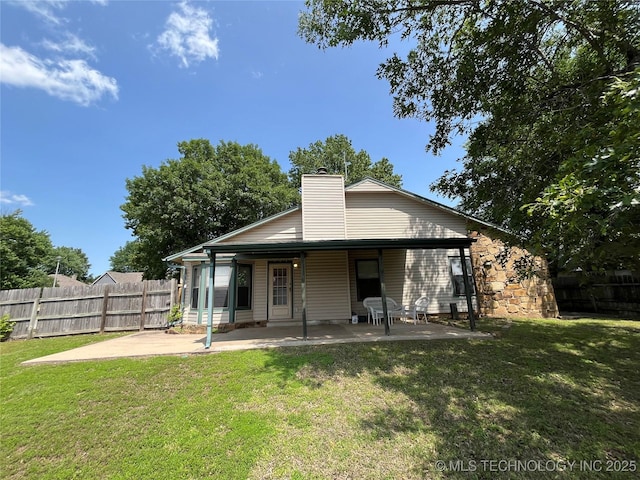 1700 S Cypress Ave, Broken Arrow, OK 74012 - back of house featuring a patio and a chimney