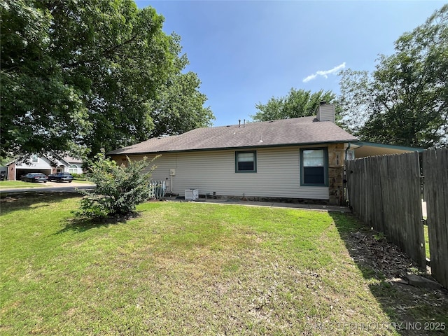 1700 S Cypress Ave, Broken Arrow, OK 74012 - rear view of house featuring a chimney