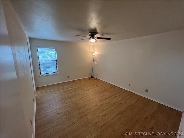 1700 S Cypress Ave, Broken Arrow, OK 74012 - empty room with a ceiling fan and wood finished floors