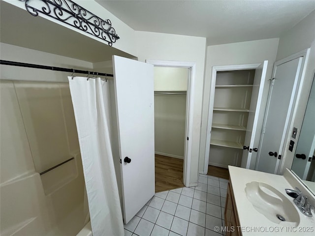 1700 S Cypress Ave, Broken Arrow, OK 74012 - full bath featuring vanity, tile patterned floors, curtained shower, and a spacious closet