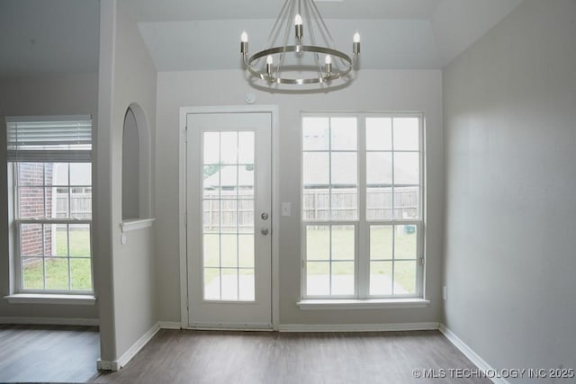 15310 E 89th Pl, Owasso, OK 74055 - entryway with a chandelier, wood finished floors, and baseboards