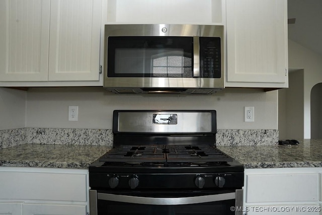 15310 E 89th Pl, Owasso, OK 74055 - kitchen featuring stainless steel appliances, white cabinets, and light stone countertops