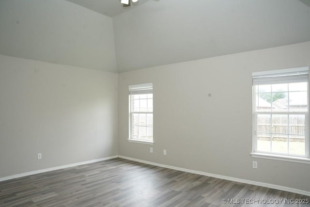 15310 E 89th Pl, Owasso, OK 74055 - empty room with wood finished floors, plenty of natural light, lofted ceiling, ceiling fan, and baseboards