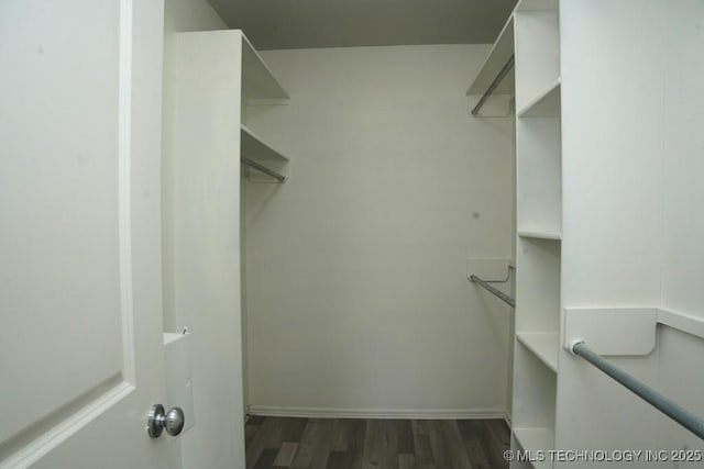 15310 E 89th Pl, Owasso, OK 74055 - walk in closet featuring wood finished floors