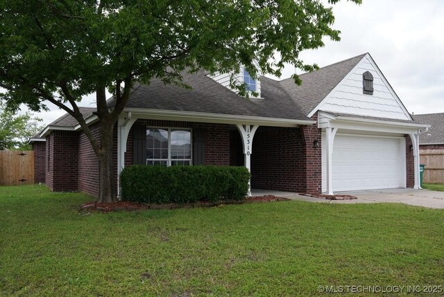 15310 E 89th Pl, Owasso, OK 74055 - view of front facade with brick siding, driveway, roof with shingles, and a garage