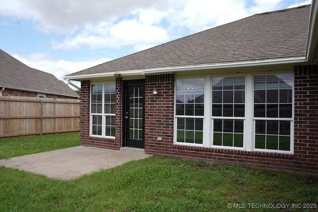 15310 E 89th Pl, Owasso, OK 74055 - rear view of property with brick siding, roof with shingles, and a patio