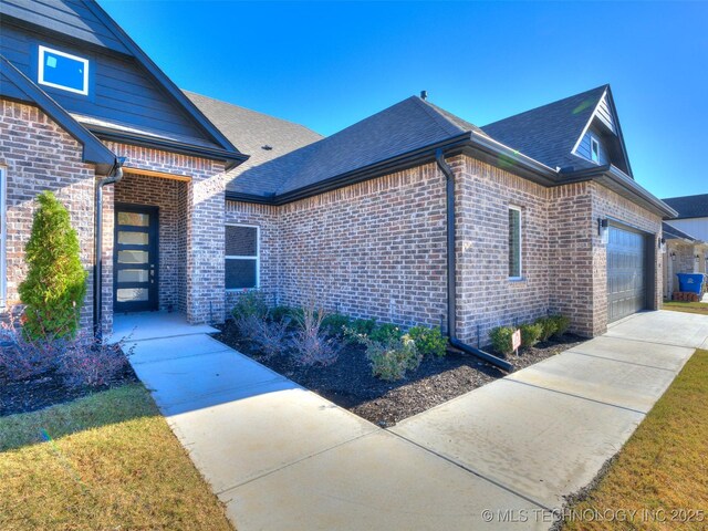 3011 S 6th Pl, Broken Arrow, OK 74012 - view of front of home featuring brick siding, an attached garage, roof with shingles, and driveway