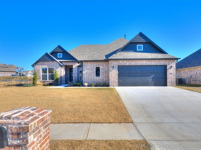 3011 S 6th Pl, Broken Arrow, OK 74012 - view of front of property featuring brick siding, a front lawn, a garage, concrete driveway, and roof with shingles