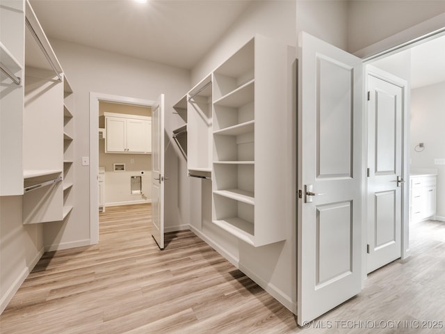 3011 S 6th Pl, Broken Arrow, OK 74012 - walk in closet with light wood-style flooring