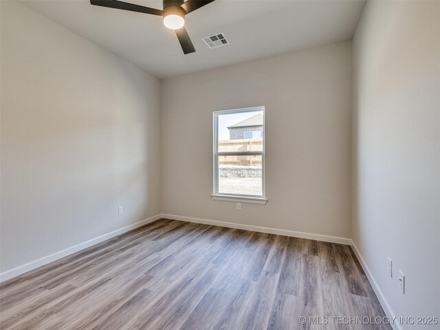3011 S 6th Pl, Broken Arrow, OK 74012 - spare room featuring wood finished floors, ceiling fan, and baseboards