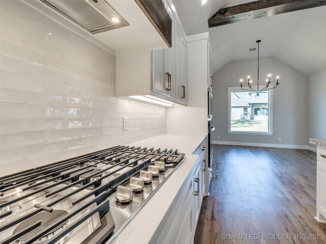 4010 W Baton Rouge St, Broken Arrow, OK 74011 - kitchen featuring stainless steel gas stovetop, tasteful backsplash, dark wood-style floors, lofted ceiling, and white cabinets