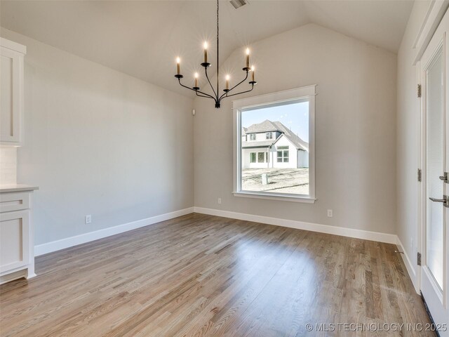 4010 W Baton Rouge St, Broken Arrow, OK 74011 - unfurnished dining area featuring a chandelier, light wood-style flooring, vaulted ceiling, and baseboards