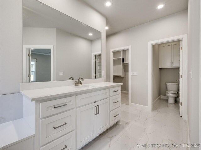 4010 W Baton Rouge St, Broken Arrow, OK 74011 - bathroom featuring recessed lighting, vanity, toilet, marble finish floors, and baseboards