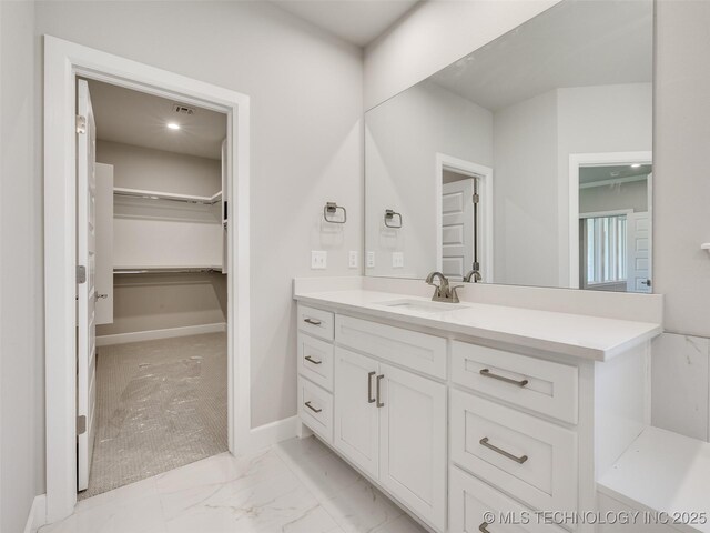 4010 W Baton Rouge St, Broken Arrow, OK 74011 - bathroom featuring vanity, a spacious closet, and marble finish flooring