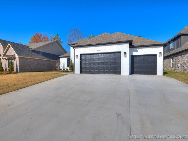 4010 W Baton Rouge St, Broken Arrow, OK 74011 - view of home's exterior featuring a garage, driveway, a lawn, roof with shingles, and brick siding