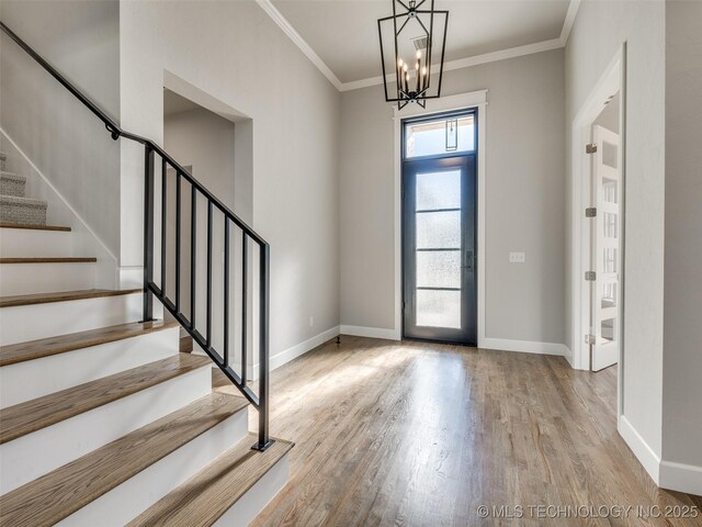 4010 W Baton Rouge St, Broken Arrow, OK 74011 - foyer featuring wood finished floors, stairs, baseboards, ornamental molding, and a chandelier