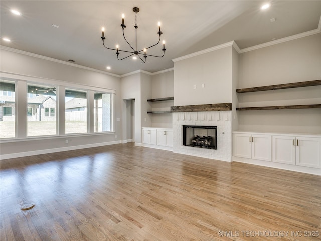 4010 W Baton Rouge St, Broken Arrow, OK 74011 - unfurnished living room with wood finished floors, a chandelier, ornamental molding, a fireplace, and recessed lighting